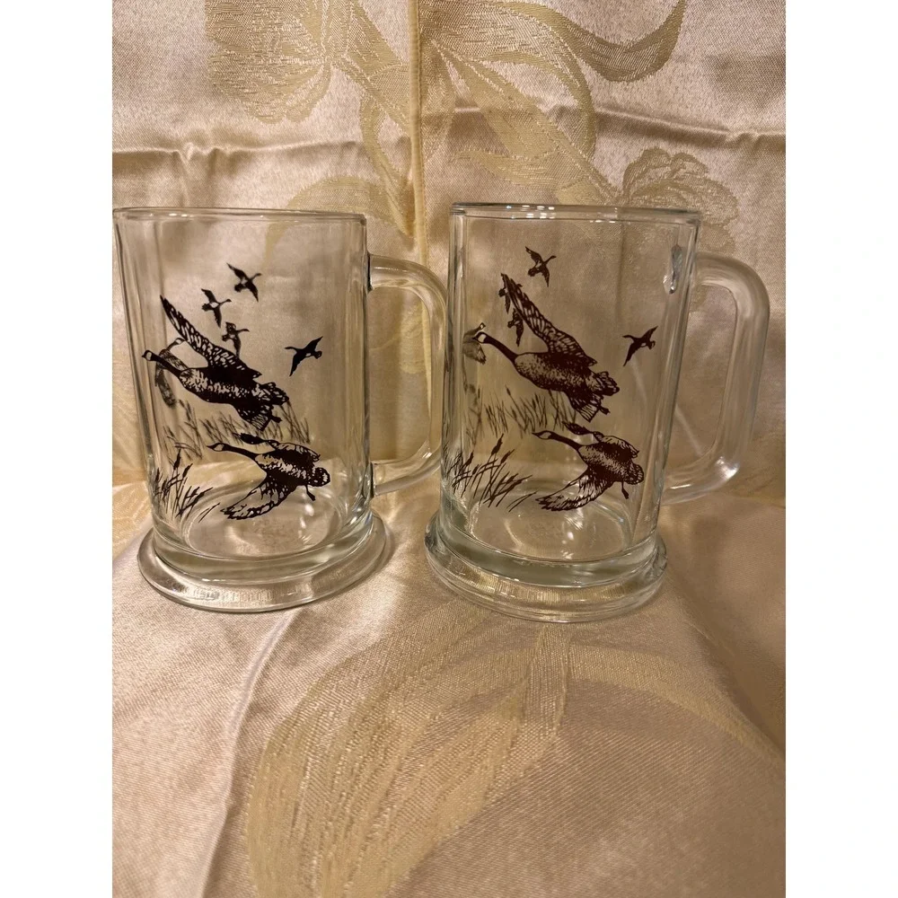 VTG AVON 1982 TANKARD MUGS STEIN CLEAR  GLASS WITH FLYING DUCKS/GEESE  Set Of 2